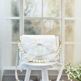 WHITE BOW BAG WITH PEARL HANDLE