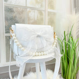 WHITE BOW BAG WITH PEARL HANDLE